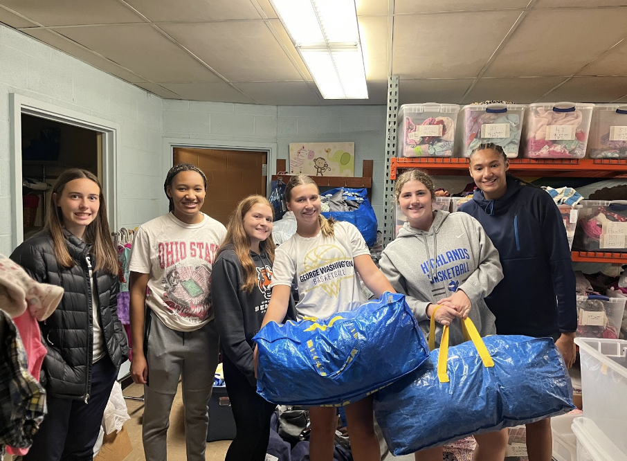 Wiley Willis (11), Aubrey Barrrett (12), Madison Barlow (11), Avery Barber (11), Meredith Hicks (10), and Marissa Green (12), Highlands High School girls basketball varsity players contributing to The CARE Closet by sorting bins of clothes. (Photo taken by Avery Barber)
